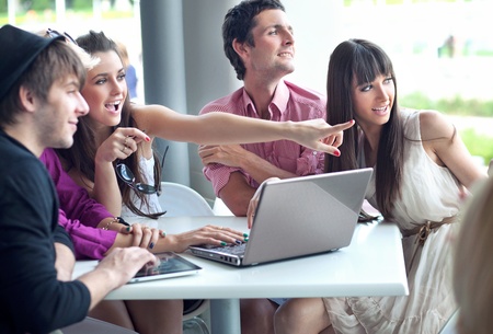 Young people browsing internet on a coffee breakの写真素材