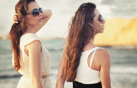 Two smiling beauties on holiday tripの写真素材