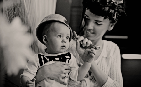Beauty woman and baby with saucepanの写真素材