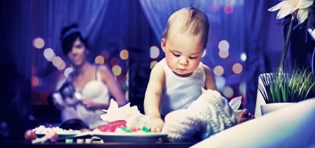 Cute child and mum in kitchenの写真素材