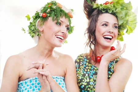 Adorable young women with vegetables hairstylesの写真素材