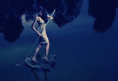 Fine art image of a woman sailing a leafの写真素材