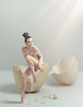 Young beauty esaping the eggshellの写真素材