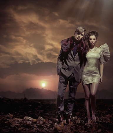 Young and calm couple over sunset backgroundの写真素材