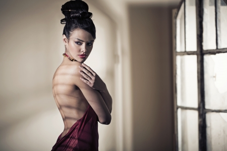 Fabulous brunette beautiful girl wearing evening dressの写真素材