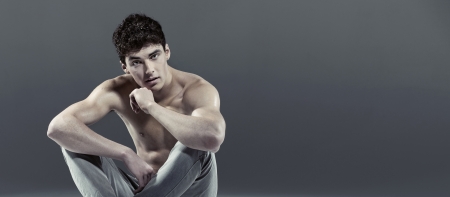 Handsome young athlete with curly hairの写真素材