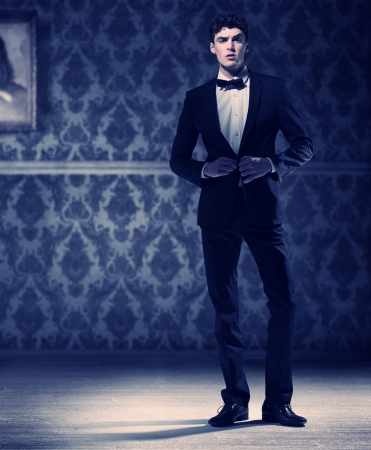 Athlete young man wearing perfect black tuxedoの写真素材