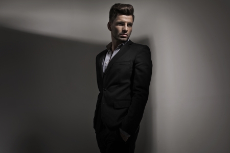 Fashion style photo of young guy dressed in suitの写真素材
