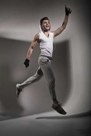 Jumping handsome guy during trainingの写真素材