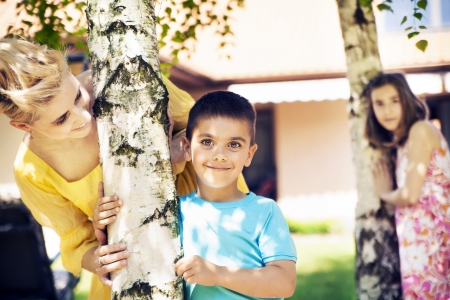 Attractive mother looking after her lovely childrenの写真素材