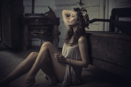 Shapely young brunette lady in old interiorの写真素材
