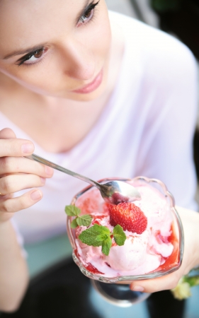 Delicate alluring lady with fresh dessertの写真素材