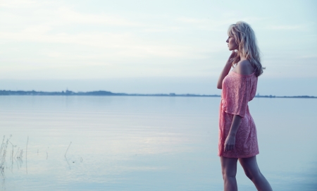 Delicate blonde lady wearing nice dressの写真素材