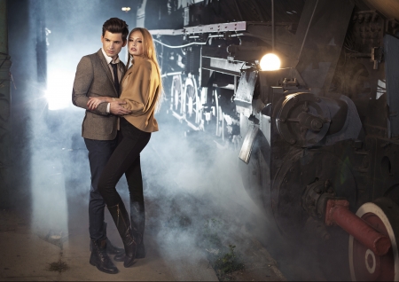 Elegant young couple at the railway stationの写真素材