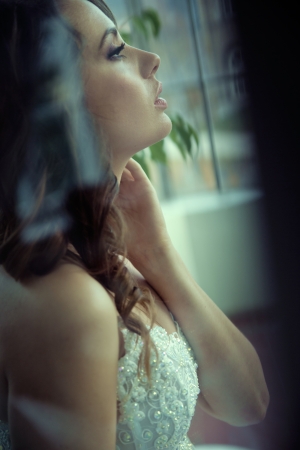 Profile portrait  of delightful young brideの写真素材