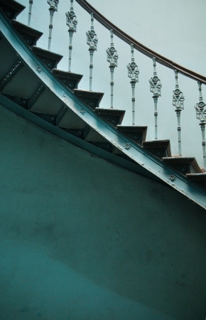 Wooden spiral stairs in ancient palace interiorの写真素材