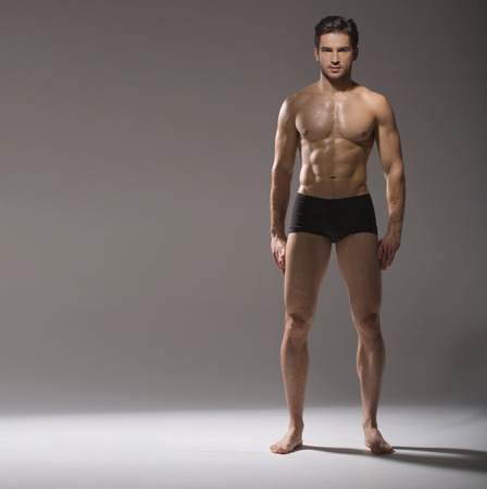 Muscular handsome man in calm poseの写真素材