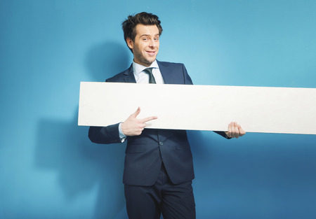 Smart banker with the empty white boardの写真素材