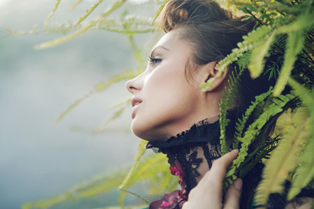 Brunette lady in the tropical forestの写真素材