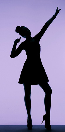 Black silhouette of the pretty young womanの写真素材