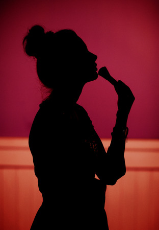 Young sexy lady making upの写真素材