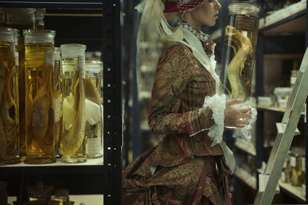 Conceptual potrait of the woman in the retro laboratory