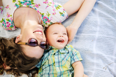 Fabulous mother and her cute laughing sonの写真素材