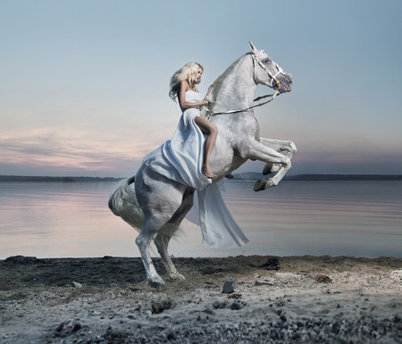 Amazing portrait of blond lady on the horse