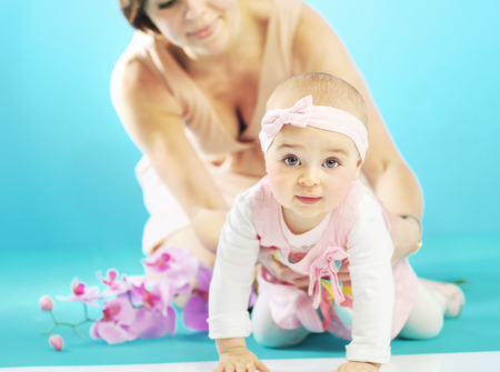 Cute little girl and her caring motherの写真素材