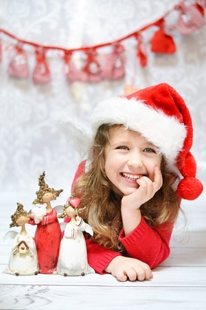 Beautiful little lady enjoying Christmasの写真素材