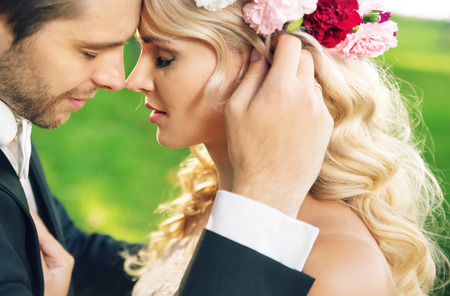 Closeup portrait of the young marriage couple