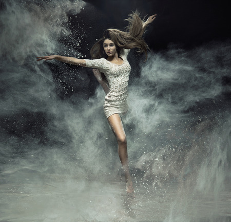 Talented ballet dancer catching the white dustの写真素材