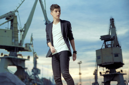 Trendy handsome man in industry area
