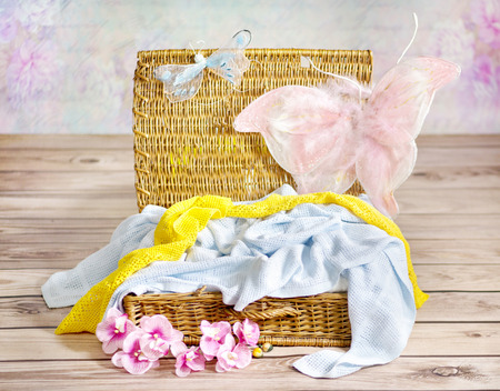 Colorful towels in the wicker basketの写真素材