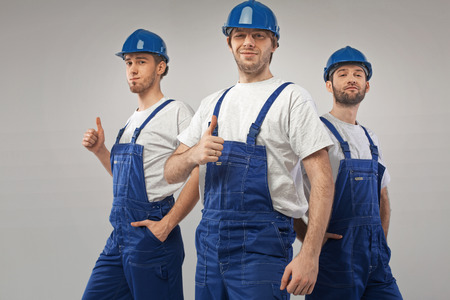 Art portrait of the three handsome employees