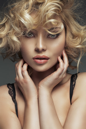 Closeup portrait of a lady with curly haisrtyleの写真素材