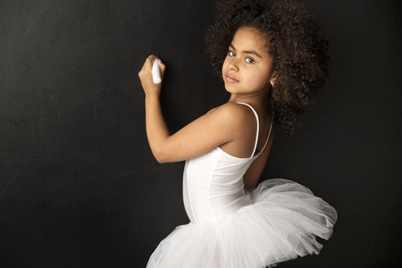 Cute little ballet dancer drawing with a chalkの写真素材