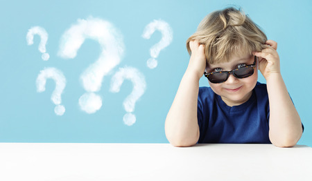 Cute little boy with questionsの写真素材
