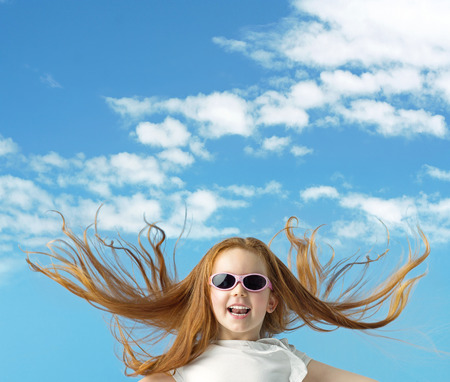 Happy little kid with big sunglassesの写真素材