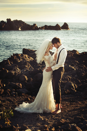 Romantic portrait of young and happy newlywedsの写真素材