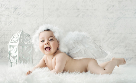 Portrait of a small cute angelの写真素材