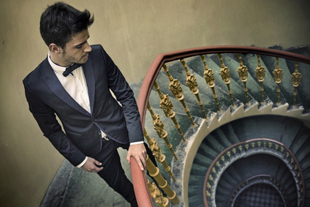 Attractive man in the old tenement houseの写真素材