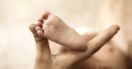 Conceptual photo of hand holding a littleの写真素材