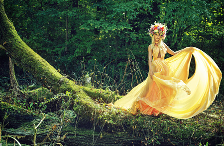 Elegant blond woman with the colorful chapletの写真素材