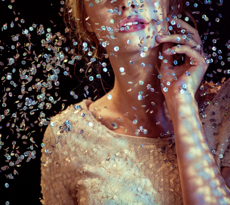 Conceptual picture of a lady looking at the sequin rainの写真素材