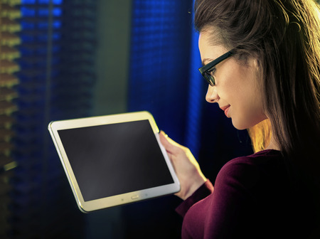Portrait of a pretty womanl using a new technologyの写真素材