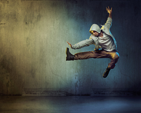 Athletic dancer in a super jumping pose Athletic dancer in a super jumping pose