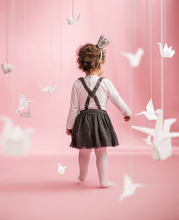 Cute baby walking in the toy roomの写真素材