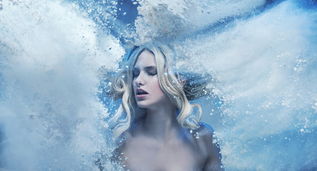 Conceptual picture of a beuatiful lady in the rain of dustの写真素材