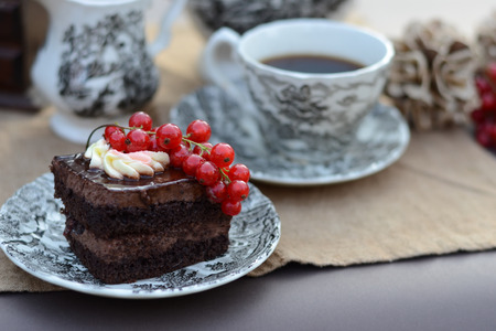 Chocolate pastry with fresh fruit served with a cup of black coffeeの写真素材